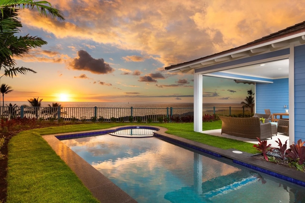 Vacation rental exterior with pool and sunset view